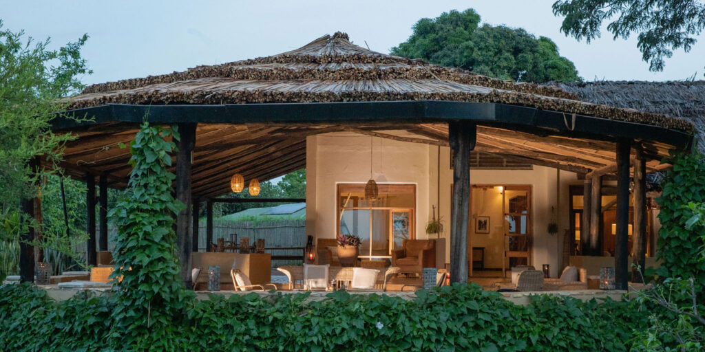 Luxury safari lodge in Uganda overlooking natural landscape with high-end accommodation and exclusive wildlife experience